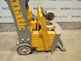 a yellow forklift with a stuffed animal on top of it