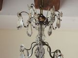 a chandelier hanging from the ceiling in a room