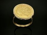 l'image d'un anneau d'or surmonté d'une pièce de monnaie