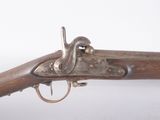 a close up of a gun on a white surface with a white background