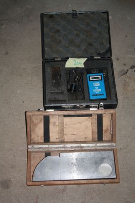 a box with tools in it sitting on the floor