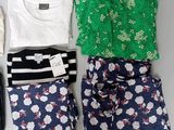 several pieces of clothing are laid out on a white surface