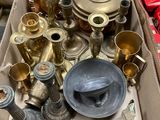 a box full of brass items on a table