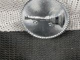 a close up of a hat with a metal buckle on it