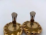 pair of gold tone earrings with flower design