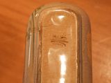 a close up of a glass vase on a table