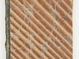 a close up of a piece of paper on a white surface