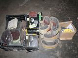 several pairs of shoes are sitting in a box on the floor