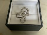 an image of a ring in a box on a table