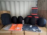 many bags of luggage sitting on top of a box