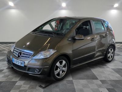 a picture of a mercedes b - class parked in a showroom