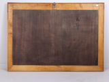 an old blackboard with a wooden frame on a white surface