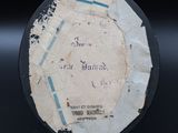a piece of paper with writing on it on a black surface