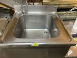 a stainless steel sink that is sitting on a counter