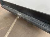 a close up of a car door with a small hole in the side