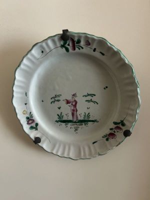 a white plate with a picture of a man on it