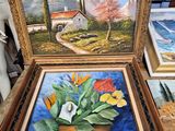 painting of flowers in a pot on a table next to other paintings