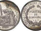 a silver coin with the image of a woman sitting on top of it