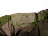 a close up of a military jacket with a patch on it