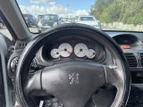 dashboard of a car with a steering wheel and gauges on the dashboard