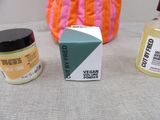 three different types of skin care products sitting on a table