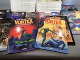 a lot of comic books sitting on a table