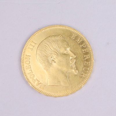 une pièce d'or sur laquelle figure le visage d'un homme