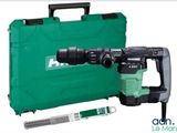 une photo d'un marteau de démolition avec un sac vert et des outils