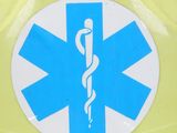 a sticker on the back of a car with a medical symbol on it