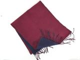 a red and blue scarf on a white surface