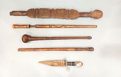 four different types of wooden tools on a white surface