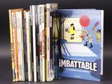 a lot of books that are sitting on a table