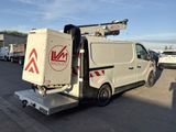 a white van that is parked in a parking lot