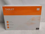 the box of the tablet is sitting on a white surface