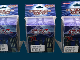 three packs of magic knight cards on display in a store