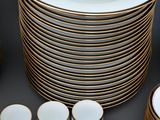 a lot of plates and cups on the table
