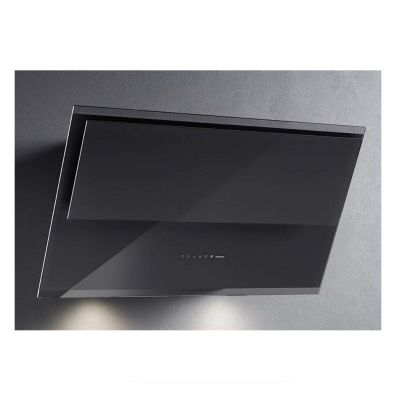 a close up of a black stove hood on a wall