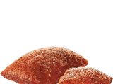 two pieces of doughnuts with a bite taken out of them