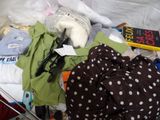 a basket full of clothes and a pair of scissors