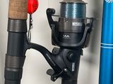a fishing rod and a fishing reel on a shelf