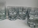a lot of glasses that are sitting on a table