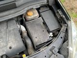 the engine of a car with its hood open and the hood open