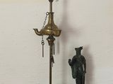 a lamp that is on a table next to a figurine