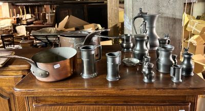 a table with a lot of antique items on it