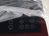 a remote control in a plastic bag on a table