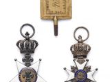 trois médailles et une médaille sur fond blanc