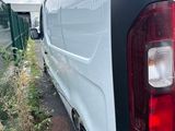 a white van that is parked on the side of the road