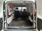 a white van with two black seats in the back of it