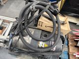 an image of a pile of assorted items in a garage