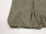 an image of a pair of khaki pants on a white surface